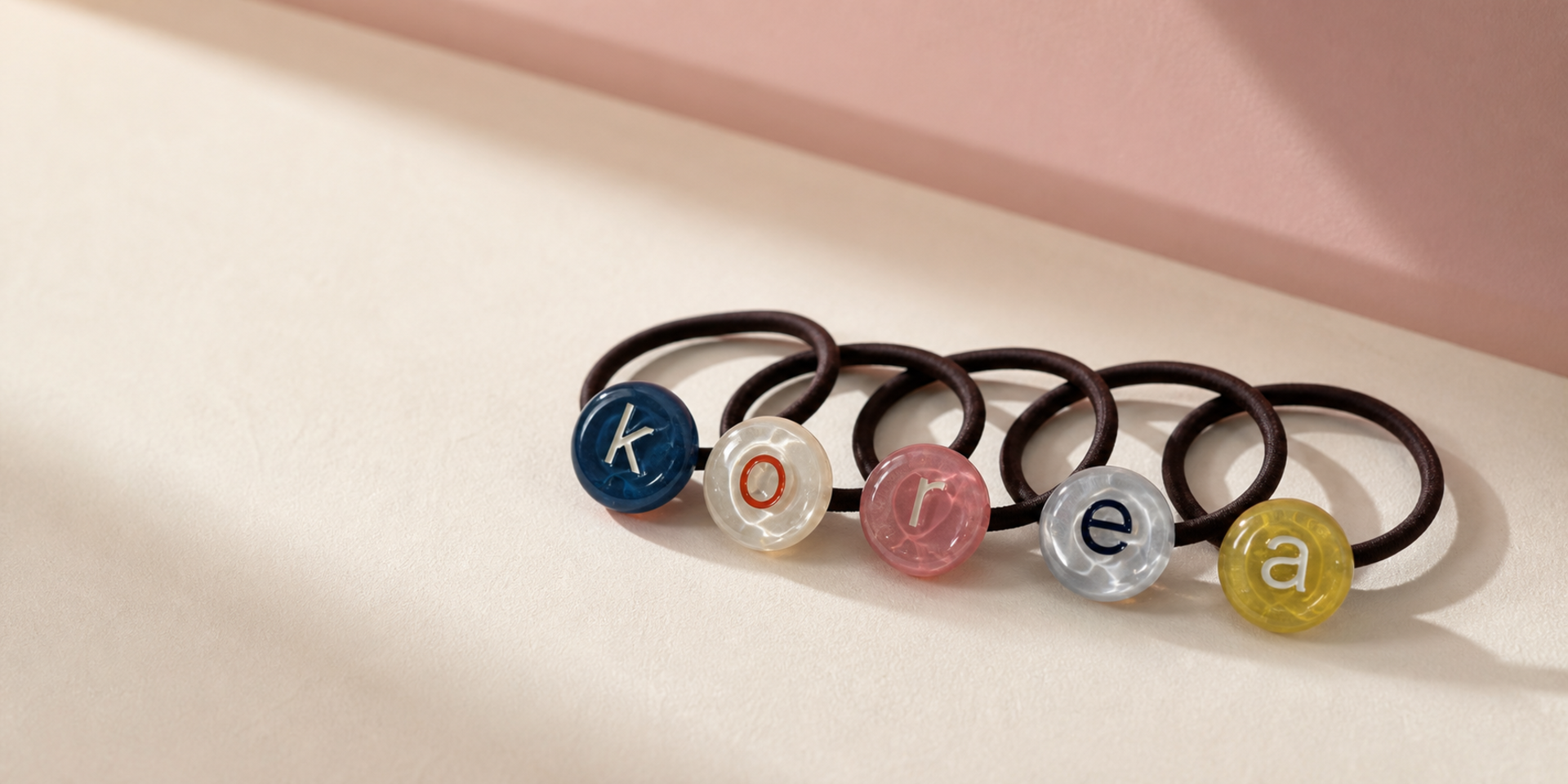KORY hair ties with five acrylic pendants spelling KOREA